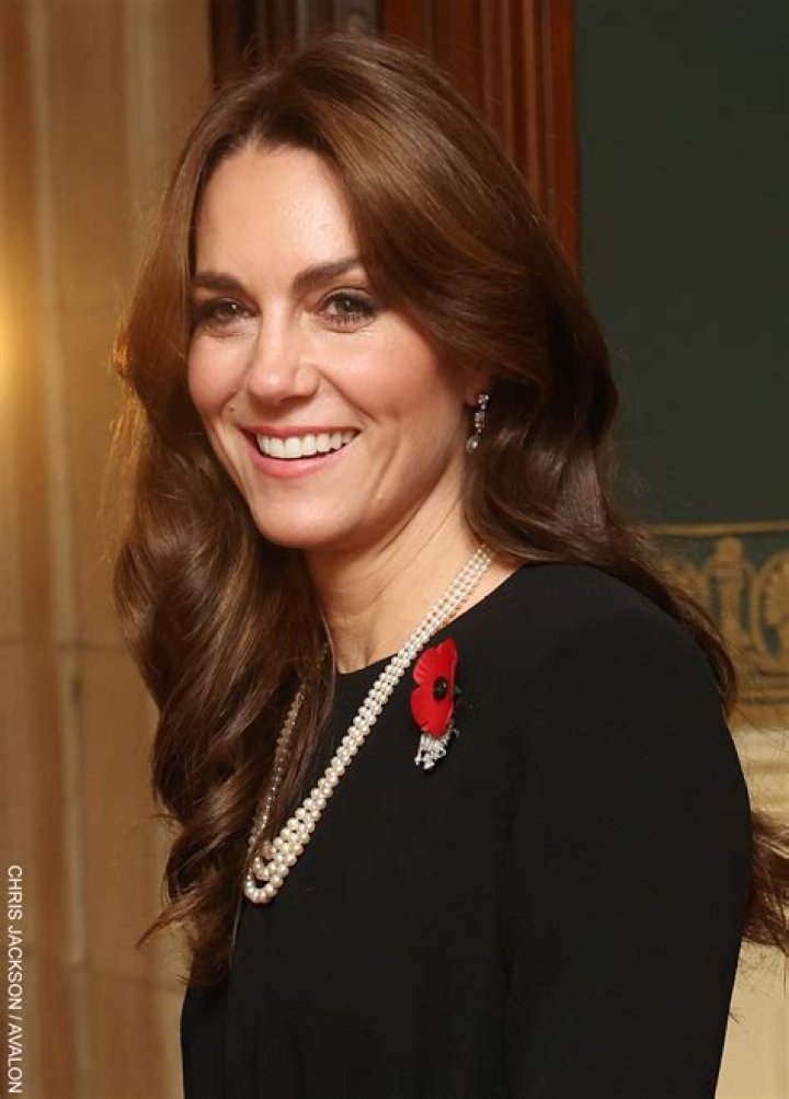 Princess Kate wearing black and white polka dots and a hat