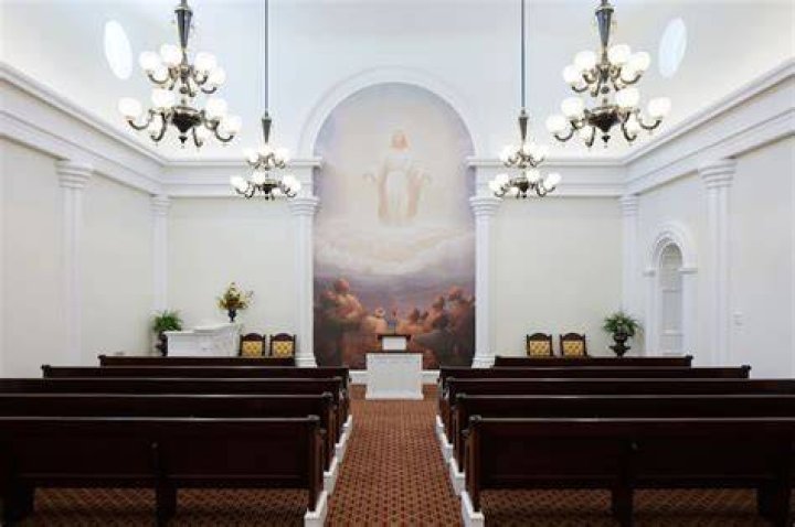 The chapel waiting area inside the St. George Utah Temple with a mural of the Savior.