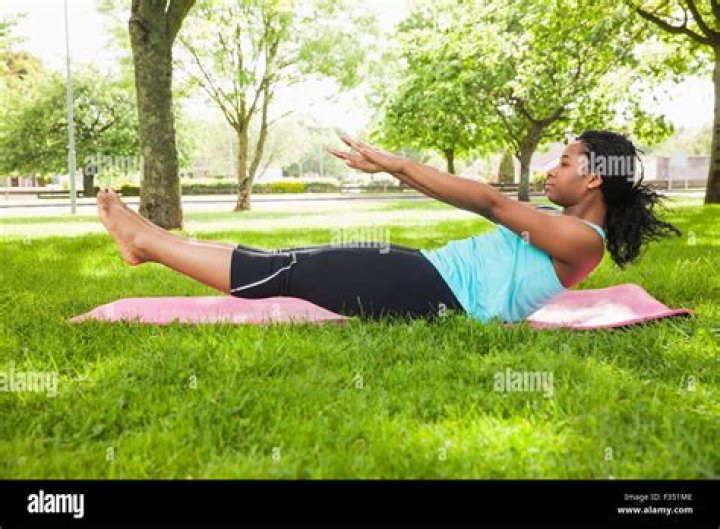 woman doing pilates on mat